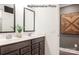 Double vanity bathroom with modern finishes and large mirrors at 2173 Millennium Dr # 40, Lancaster, SC 29720