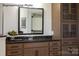Elegant bathroom vanity with dark brown cabinets and a granite countertop at 2173 Millennium Dr # 40, Lancaster, SC 29720