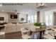 Open dining area with wooden table and chairs, adjacent to living room at 2173 Millennium Dr # 40, Lancaster, SC 29720