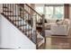 Elegant staircase with dark wood and metal railings, overlooking living room at 2173 Millennium Dr # 40, Lancaster, SC 29720