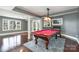 Finished basement game room featuring a pool table and access to the backyard at 2510 Tulip Hill Dr, Charlotte, NC 28270
