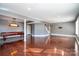 Spacious basement recreation area with pool table and hardwood floors at 2510 Tulip Hill Dr, Charlotte, NC 28270