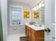 Bright bathroom with a large vanity and window at 2510 Tulip Hill Dr, Charlotte, NC 28270