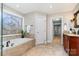 Bathroom with soaking tub, walk-in shower, and stained glass window at 2510 Tulip Hill Dr, Charlotte, NC 28270