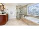 Bathroom with soaking tub, walk-in shower, and stained glass window at 2510 Tulip Hill Dr, Charlotte, NC 28270