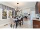 Bright dining area with window seat and view into Gathering room at 2510 Tulip Hill Dr, Charlotte, NC 28270