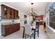 Kitchen features a butlers pantry and adjacent dining area with built in cabinets at 2510 Tulip Hill Dr, Charlotte, NC 28270