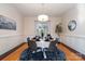 Formal dining room with hardwood floors, wainscoting, and a chandelier at 2510 Tulip Hill Dr, Charlotte, NC 28270
