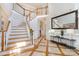 Elegant two-story entryway, showcasing a grand staircase at 2510 Tulip Hill Dr, Charlotte, NC 28270
