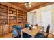 Home office with built-in wooden shelves and a window seat at 2510 Tulip Hill Dr, Charlotte, NC 28270