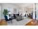 Bright living room with hardwood floors, neutral decor, and ample natural light at 2510 Tulip Hill Dr, Charlotte, NC 28270