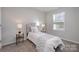 Small bedroom with a patterned headboard and window at 336 E Lincoln St, Concord, NC 28025