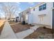 Townhome community with sidewalk access and well-maintained landscaping at 336 E Lincoln St, Concord, NC 28025
