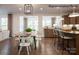 Open concept kitchen features island with seating, hardwood floors, and modern cabinetry at 3535 Rapport Ct # 023, Lancaster, SC 29720