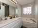 Bathroom boasts a double vanity, soaking tub, and a shower at 364 Holstein Dr, Dallas, NC 28034