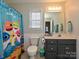 Small bathroom with toilet, sink, and shower at 364 Holstein Dr, Dallas, NC 28034