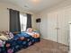 Bedroom with twin bed, ample closet space, and window at 364 Holstein Dr, Dallas, NC 28034