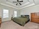Large bedroom with king bed, ceiling fan, and plenty of natural light at 364 Holstein Dr, Dallas, NC 28034