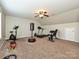 Home gym with treadmill, elliptical, weights, and punching bag at 364 Holstein Dr, Dallas, NC 28034