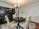 Dining area with built-in bar and charming patterned chairs at 364 Holstein Dr, Dallas, NC 28034
