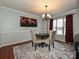 Dining room with dark wood table, patterned chairs, and a chandelier at 364 Holstein Dr, Dallas, NC 28034