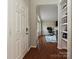 View of entryway with hardwood floors, built-in shelving, and a view into the living room at 364 Holstein Dr, Dallas, NC 28034