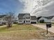 Two-story house with a two-car garage and landscaped yard at 364 Holstein Dr, Dallas, NC 28034
