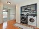 Upstairs laundry room with washer, dryer, and built-in shelving at 364 Holstein Dr, Dallas, NC 28034