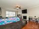 Relaxing living room includes a sectional sofa, fireplace, and built-in shelving at 364 Holstein Dr, Dallas, NC 28034