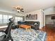 Living room with sectional sofa, hardwood floors, and built-in shelving at 364 Holstein Dr, Dallas, NC 28034