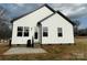 Newly built home with a patio and grassy backyard at 401 Fourth St, Stanley, NC 28164