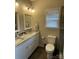 Bathroom with double vanity and granite countertops at 401 Fourth St, Stanley, NC 28164