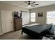 Main bedroom with a barn door, ceiling fan, and large windows at 401 Fourth St, Stanley, NC 28164
