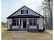 Charming new construction with craftsman details, including black shutters and a welcoming front porch at 401 Fourth St, Stanley, NC 28164