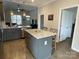 Kitchen island with granite top and built-in trash bins at 401 Fourth St, Stanley, NC 28164