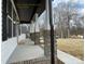 Covered front porch with brick columns and a concrete walkway at 401 Fourth St, Stanley, NC 28164