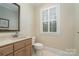 Clean bathroom with vanity and toilet at 4421 Windwood Cir, Charlotte, NC 28226