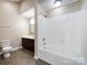 Bathroom featuring a tub, vanity with dark cabinets, and a shower at 4723 Polo Gate Blvd, Charlotte, NC 28216