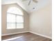 Bright, airy bedroom with a large window and vaulted ceiling at 4723 Polo Gate Blvd, Charlotte, NC 28216