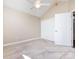 Cozy bedroom featuring neutral walls, plush carpet, closet and a ceiling fan at 4723 Polo Gate Blvd, Charlotte, NC 28216