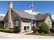 Community clubhouse with stone exterior and American flag at 4723 Polo Gate Blvd, Charlotte, NC 28216