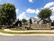 Community entrance with stone pillars and landscaping at 4723 Polo Gate Blvd, Charlotte, NC 28216