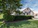 Stone house exterior with manicured lawn and landscaping at 4723 Polo Gate Blvd, Charlotte, NC 28216