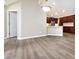 Open kitchen view featuring modern appliances, lots of cabinet space, and sleek flooring at 4723 Polo Gate Blvd, Charlotte, NC 28216