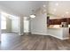 Open-concept living area with access to the kitchen, hardwood floors, and lots of natural light at 4723 Polo Gate Blvd, Charlotte, NC 28216