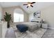 Beautifully staged bedroom with large arched window, a plush bed, and stylish decor at 4723 Polo Gate Blvd, Charlotte, NC 28216
