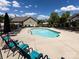 Community pool with plenty of lounge chairs at 4723 Polo Gate Blvd, Charlotte, NC 28216
