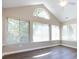 Bright sunroom featuring multiple windows and vaulted ceiling at 4723 Polo Gate Blvd, Charlotte, NC 28216