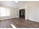 Bright sunroom with hardwood floors and French doors at 4723 Polo Gate Blvd, Charlotte, NC 28216