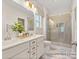 Elegant bathroom with double vanity, large shower, and marble-look flooring at 5010 Mooreland Oaks Way # 1P, Mount Holly, NC 28120